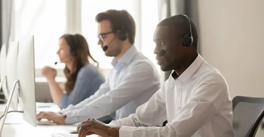 Call center operators working at their desks