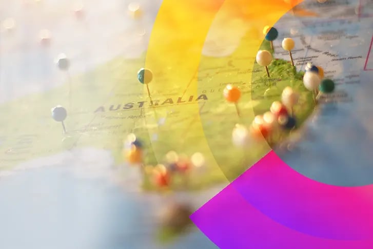 Pins located on Australia on a globe. 