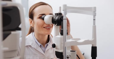 Healthcare provider looking into medical device