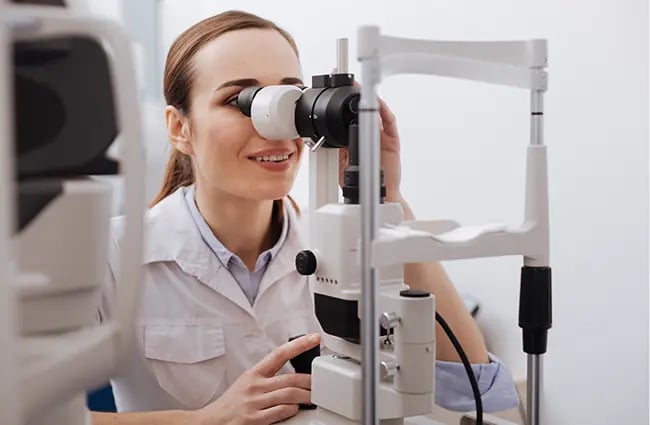 Healthcare provider looking into medical device