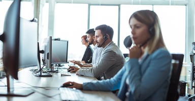 People working at computers in a call center