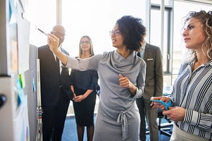 professionals-looking-at-whiteboard