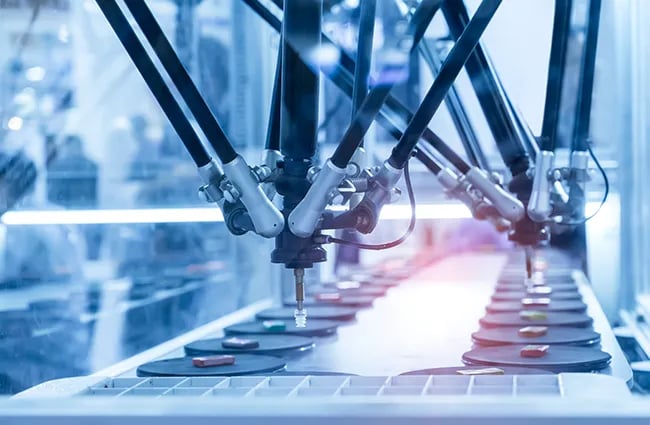 Robotic manufacturing arms working on devices