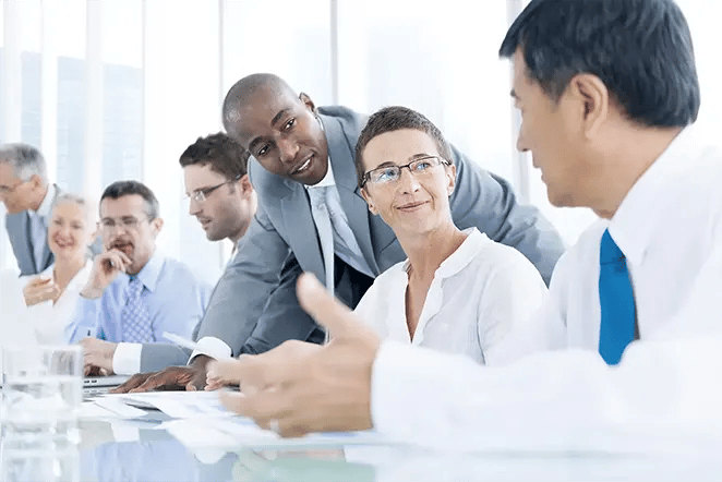 Group of business professionals working at a conference table