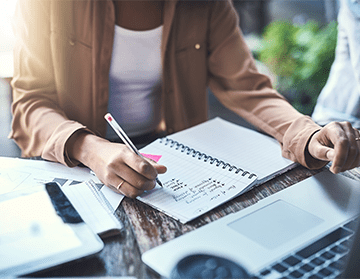 Woman writing in notebook